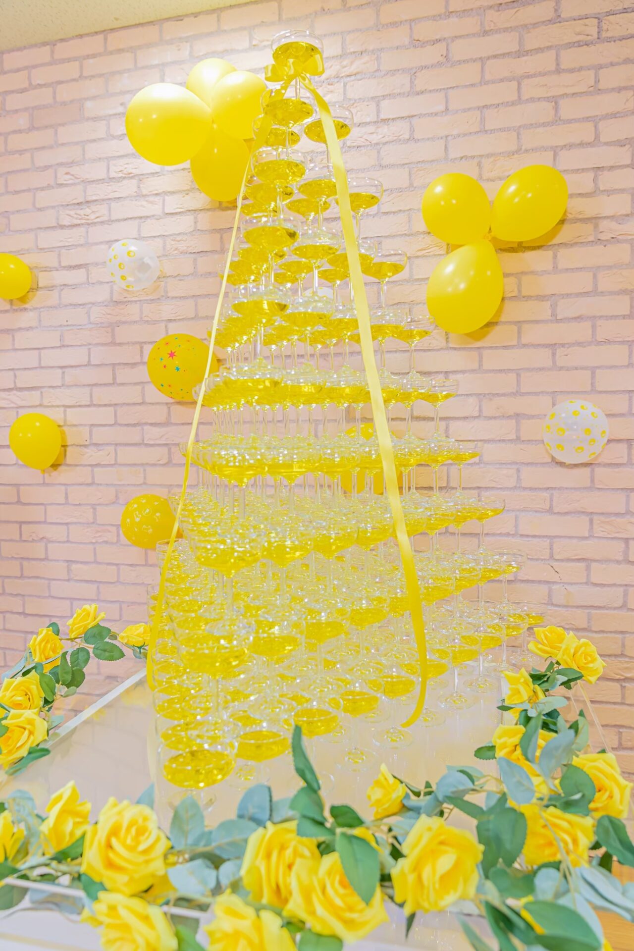 Triangular champagne tower all in yellow
